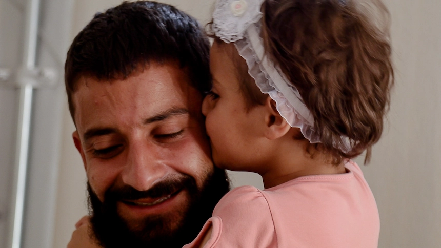 Syrian man with his young daughter