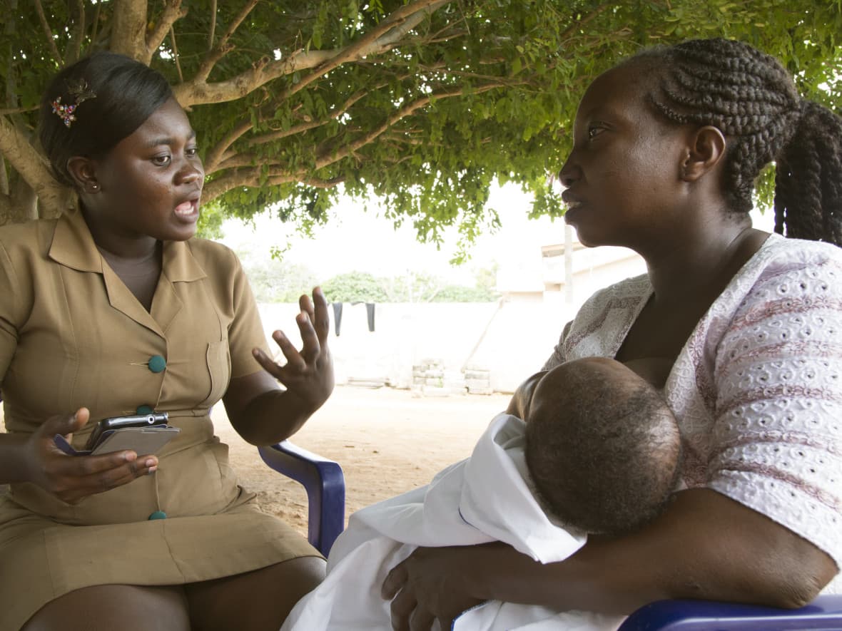 Nurse talking with mother