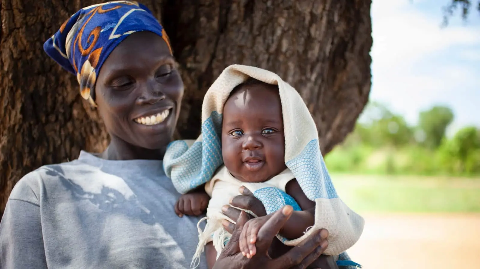 Mother holding her young baby