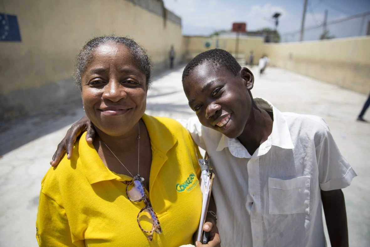 Concern’s Marie Stanise Mendes with Ricardo Joseph from Cité Soleil, who took part in a summer camp run by Concern.