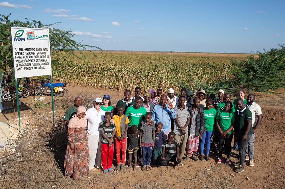 a group portrait in a field in Kenya