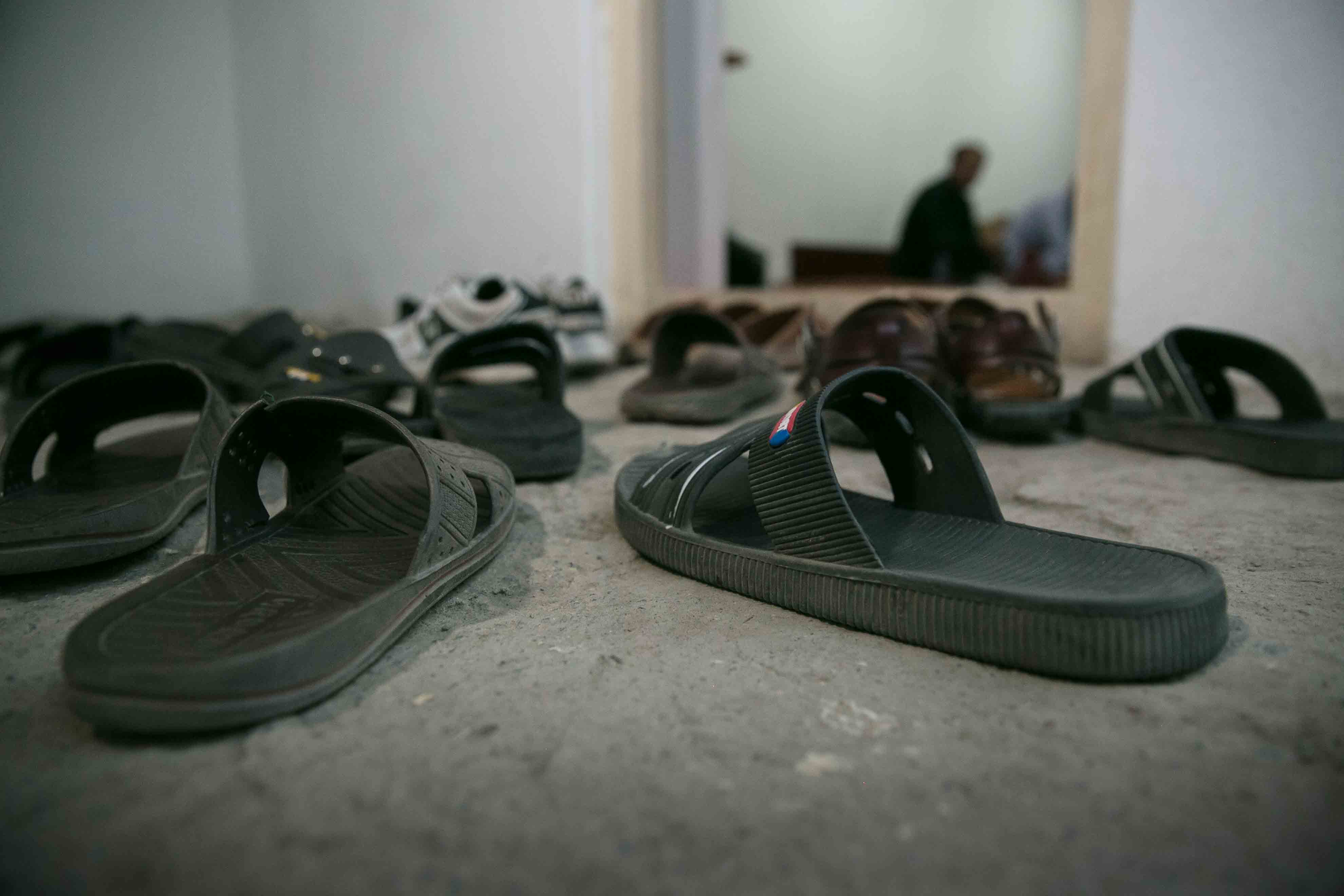 flip flops outside doorway in afghanistan