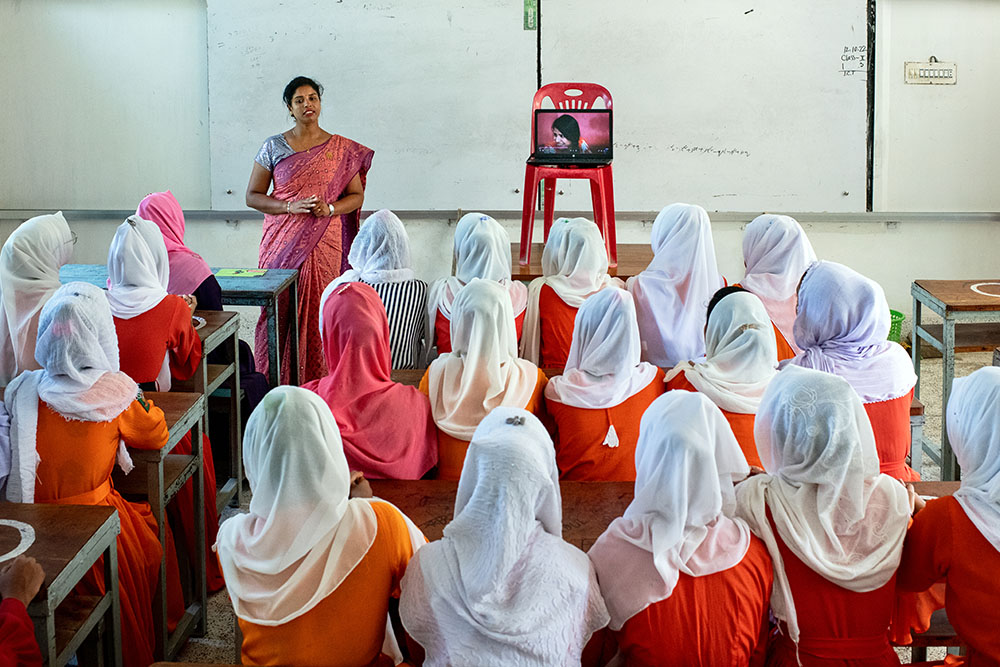 Sumaiya Parvin, a staff of Concern Worldwide and its partner organizations, attends a session with young girls and adolescents in Rajapur High School in Shoronkhola. Photo: Mohammad Rakibul Hasan/Concern Worldwide