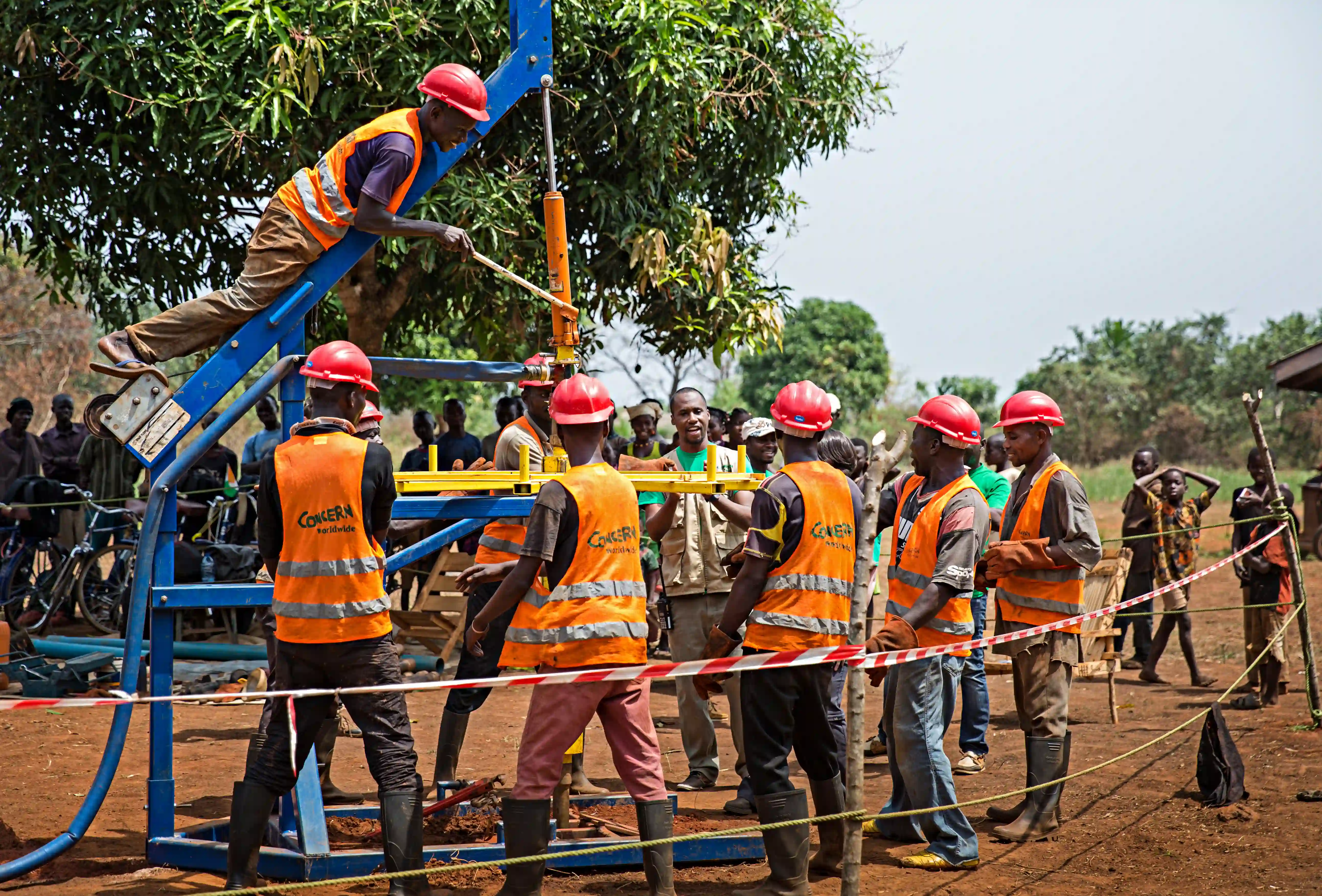 Community members drill a borehole for a well in CAR.