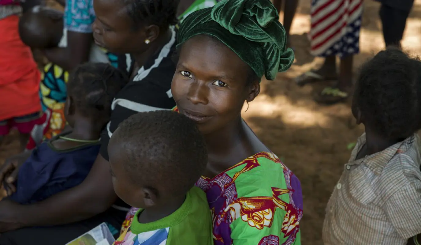 Woman posing with her infant son at Concern's mobile maternal and childhood health unit in Gbawi, CAR.