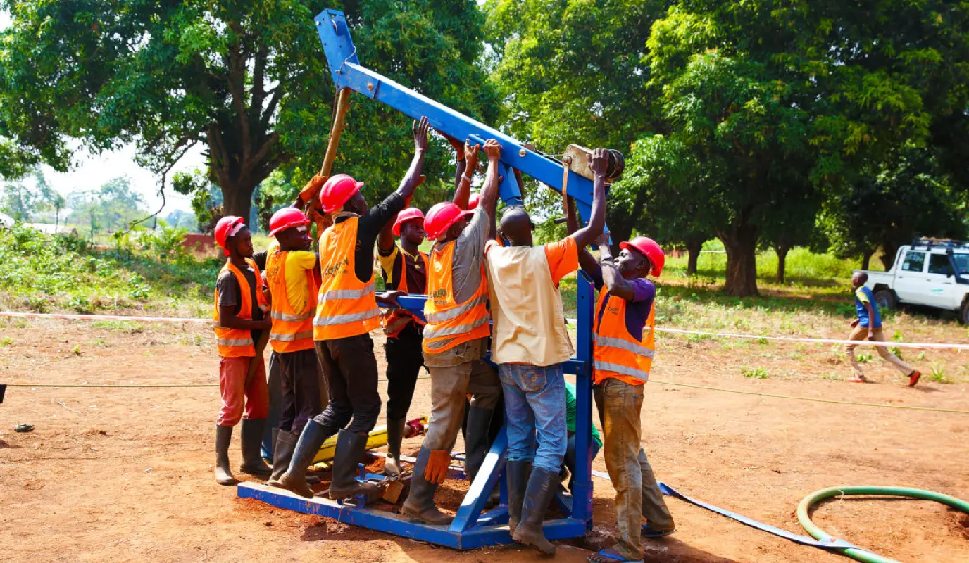 Concern team members operate a mobile drilling kit to provide new water sources for conflict-affected communities in Kouango, Central African Republic following the destruction of several key water sites. Photo: Kieran McConville