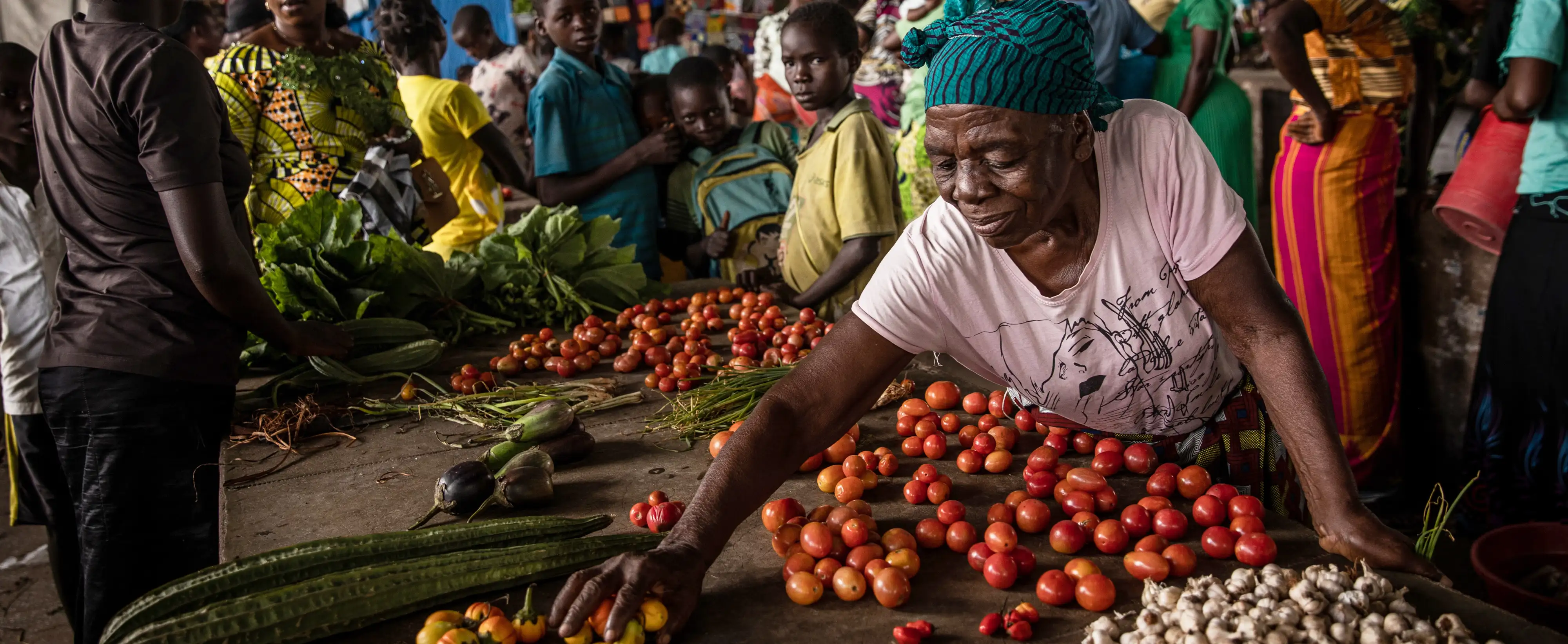 Woman at a produce market in Democratic Republic of Congo