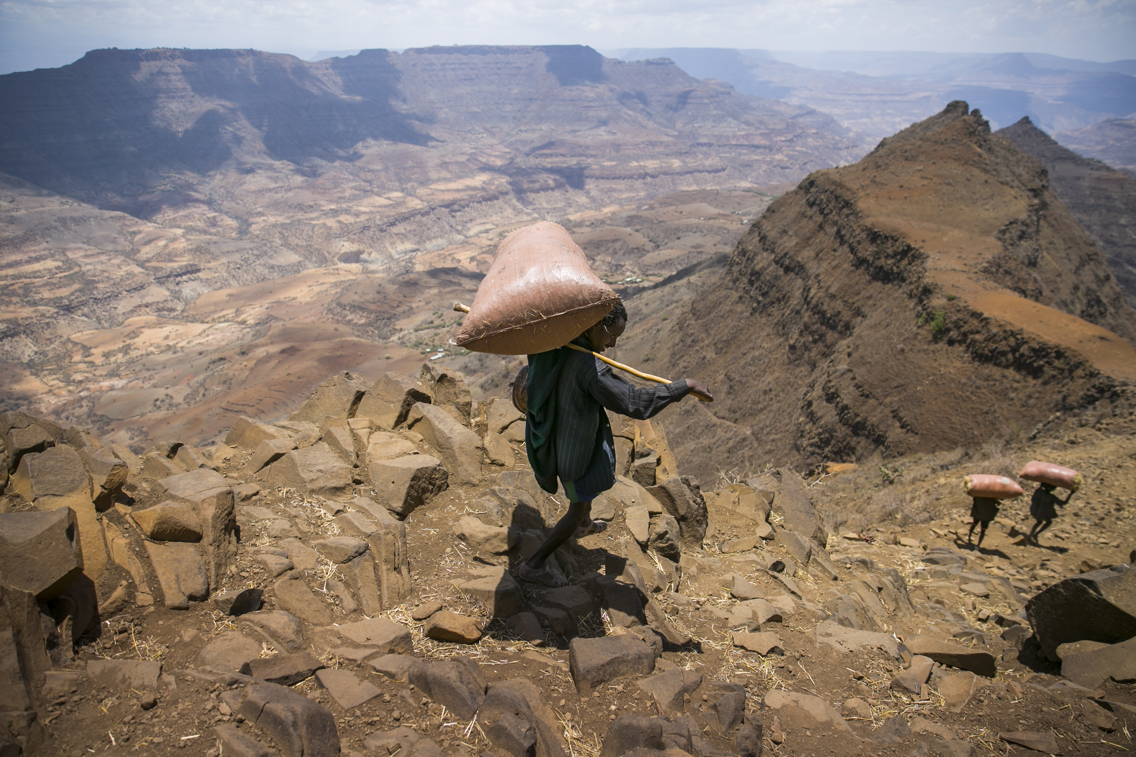Farmers carry supplies from a Concern distribution to their valley in East Gojam, Ethiopia