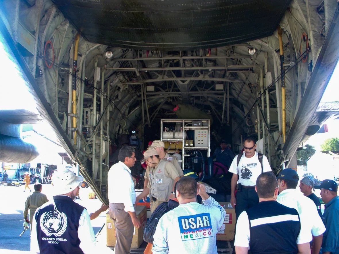 People exiting a cargo airplane