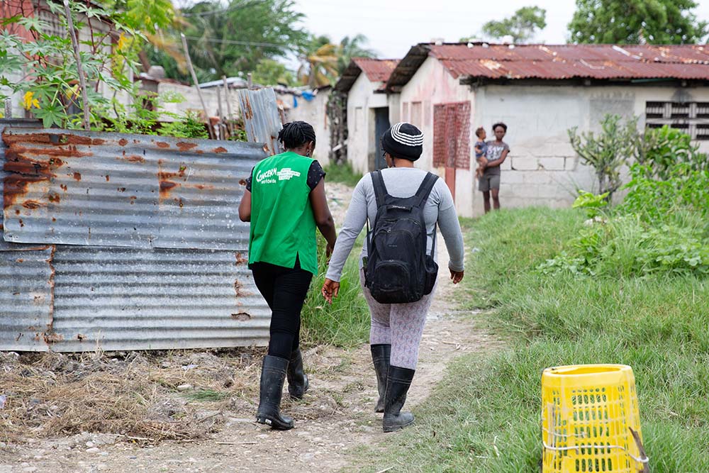Concern teams visit a family in Cité Soleil, Port-au-Prince. Violence caused by armed groups has left Haiti in turmoil, particularly enclaves like Cité Soleil. (Photo: Kieran McConville/Concern Worldwide)