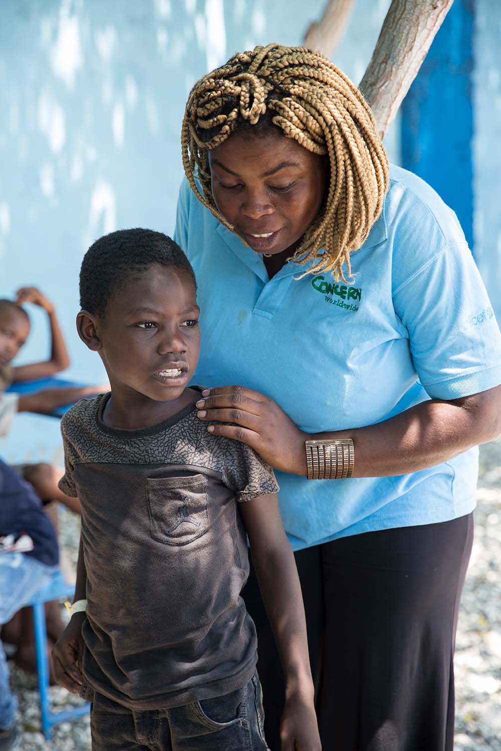 Concern worker with young child