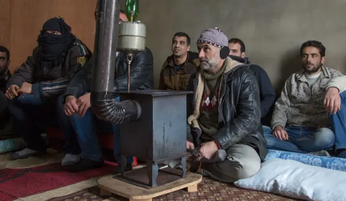 A view inside a Men's Protection Group meeting. These men have gathered to talk through their experiences with the Syrian civil war and collectively work on building a community in Lebanon.