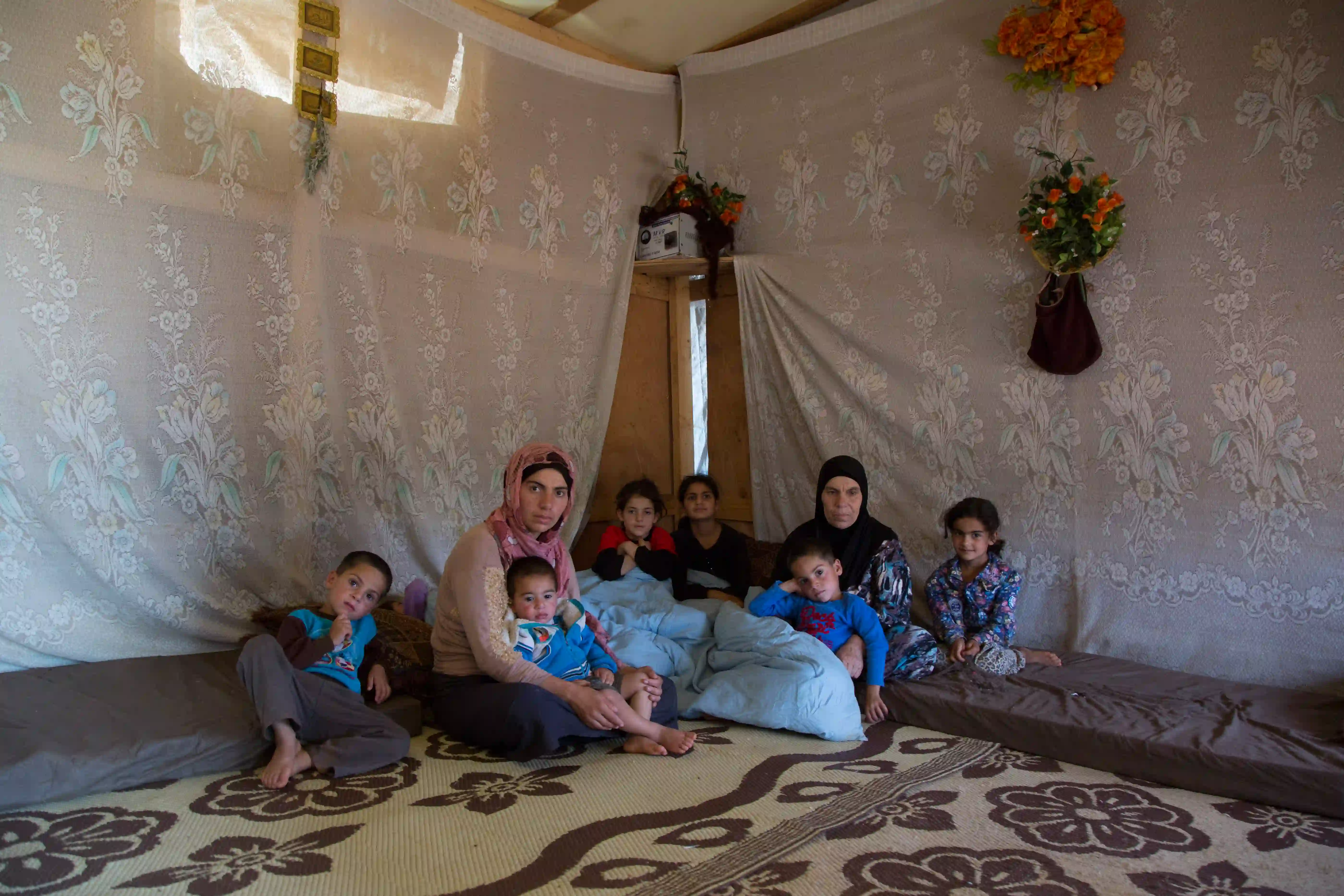 Seven children with their mother and grandmother.