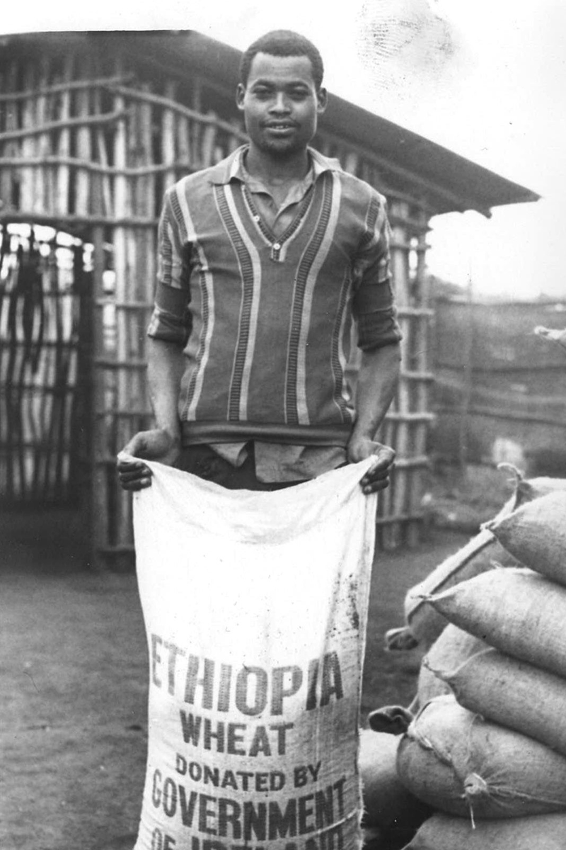 A man holds a bag of wheat shipped from Ireland to Ethiopia during the 1984-85 famine. (Photo: Concern Worldwide)