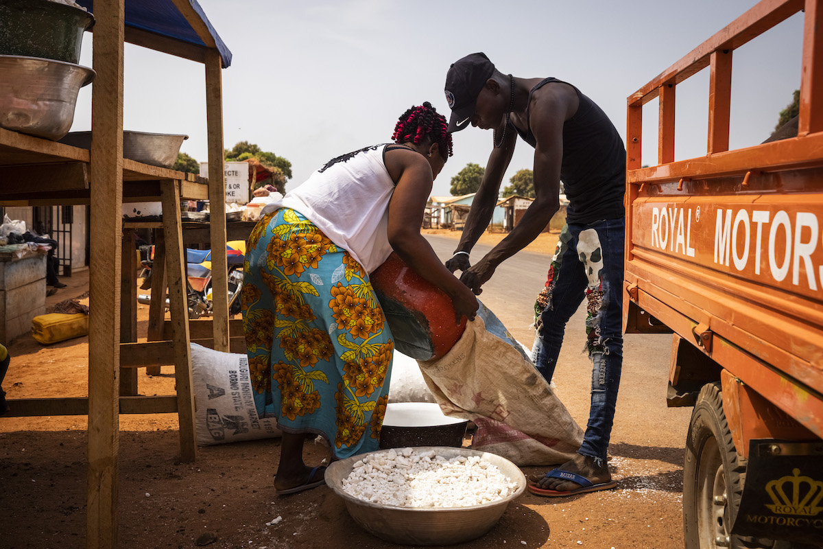Elvire Doungoule, 33 sells dried kassava at the stand she co-owns in Yaloké. (Photo: Ed Ram/Concern Worldwide)