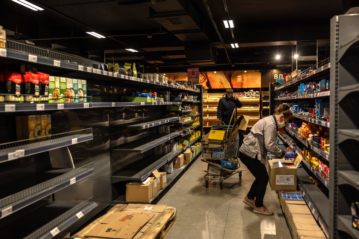 Empty shelves in a supermarket in Mykolaiv at the beginning of the war in Ukraine. While groceries are more readily-available, inflation has made them hard to afford for many Ukrainians. Supply lines out of Ukraine have also been interrupted, increasing hunger levels around the world. (Photo: Stefanie Glinski/Concern Worldwide)