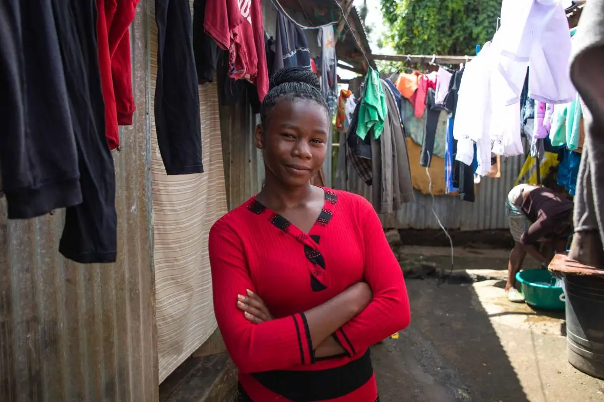A young woman in an informal urban settlement in Kenya