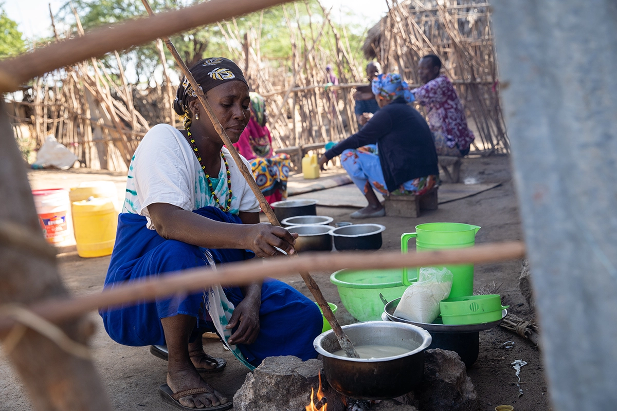 Mwanajuma Ghamaharo prepares breakfast outside her home in Makere village in Tana River County, Kenya. (Photo: Lisa Murray/Concern Worldwide)
