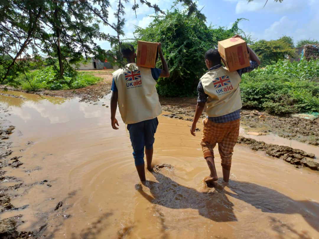 Concern and partner SHACDO staff deliver RUTF supplies on flooded roads due to El Niño. The current situations faced by health and nutrition staff who want to offer their assistance and provide Ready-to-Use Therapeutic Food (RUTF) to children who are malnourished. (Photo: Concern Worldwide)
