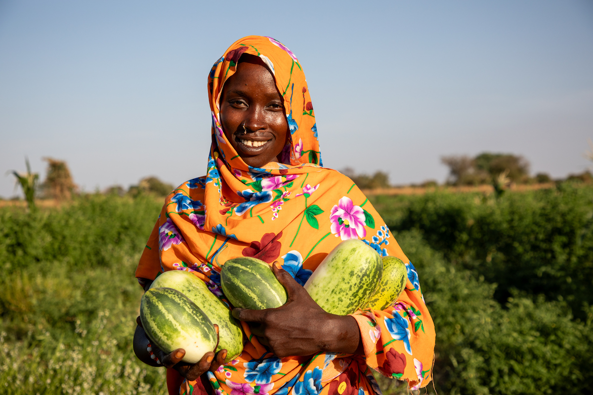 Mahadia Gamar has participated in Concern Chad's Green Graduation Program. Here, she shows off her improved harvests on her farm, and the peanut grinder she bought with Concern's support. She earns extra income grinding nuts for other women in her community. (Photos: Eugene Ikua/Concern Worldwide)