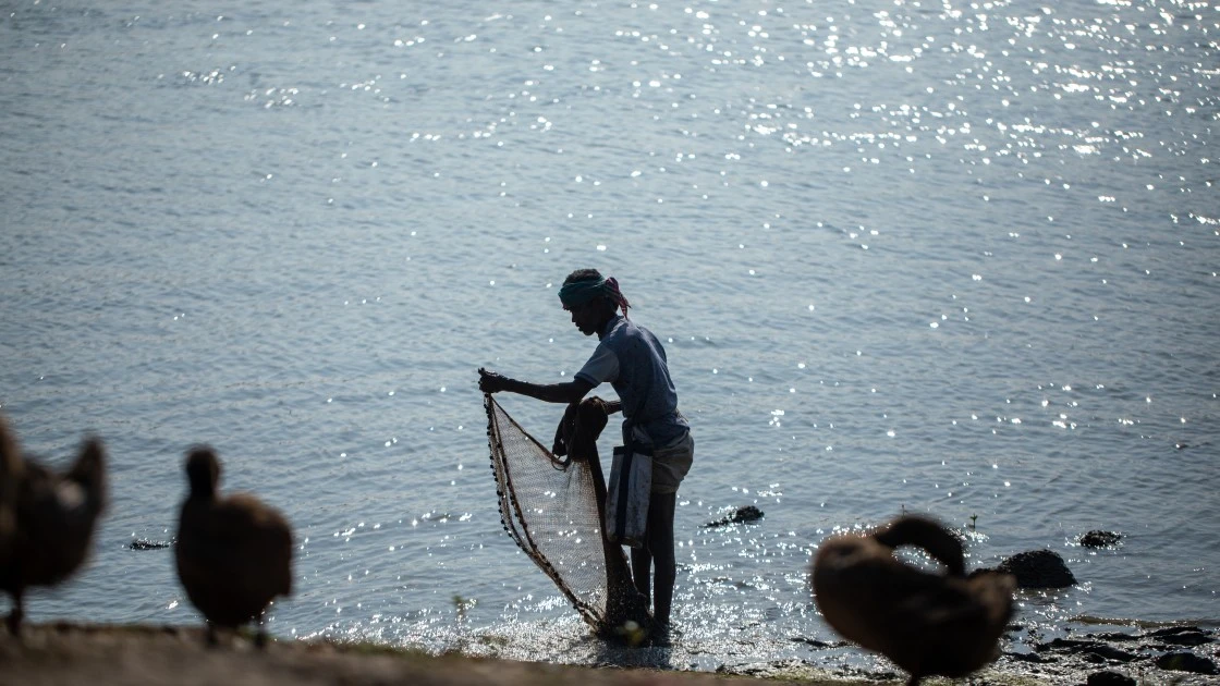 Rampada, a fisherman from the Munda community, catches fish in the river Rai, in Dacope, Bangladesh. (Photo: Mumit M/Concern Worldwide)