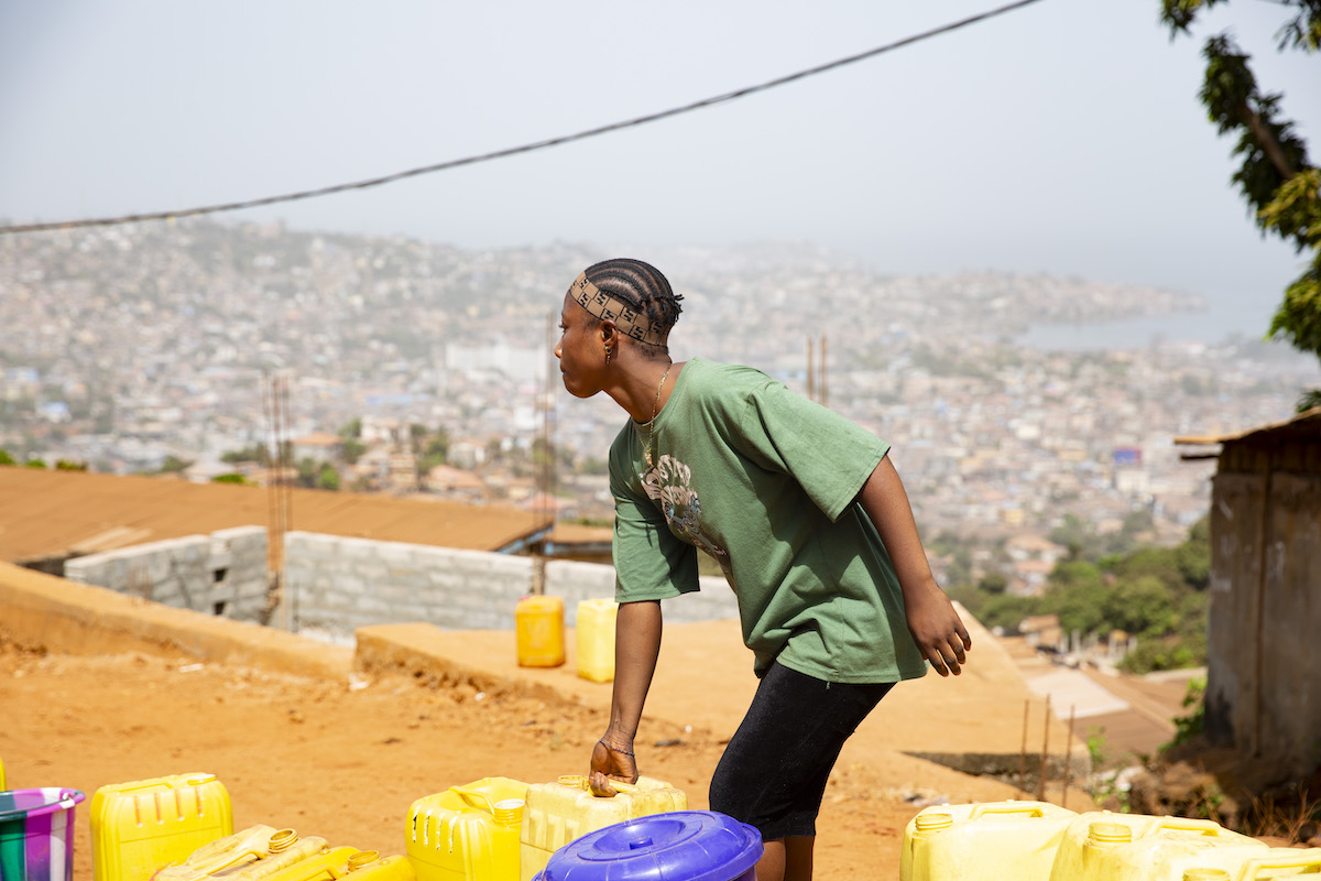 Tree Planting is an informal community overlooking Freetown in Sierra Leone. Access to clean water has been a challenge, but a partnership with Concern has resulted in a new solar-powered water system, which is managed by a locally-elected committee. Photo: Kieran McConville/Concern Worldwide