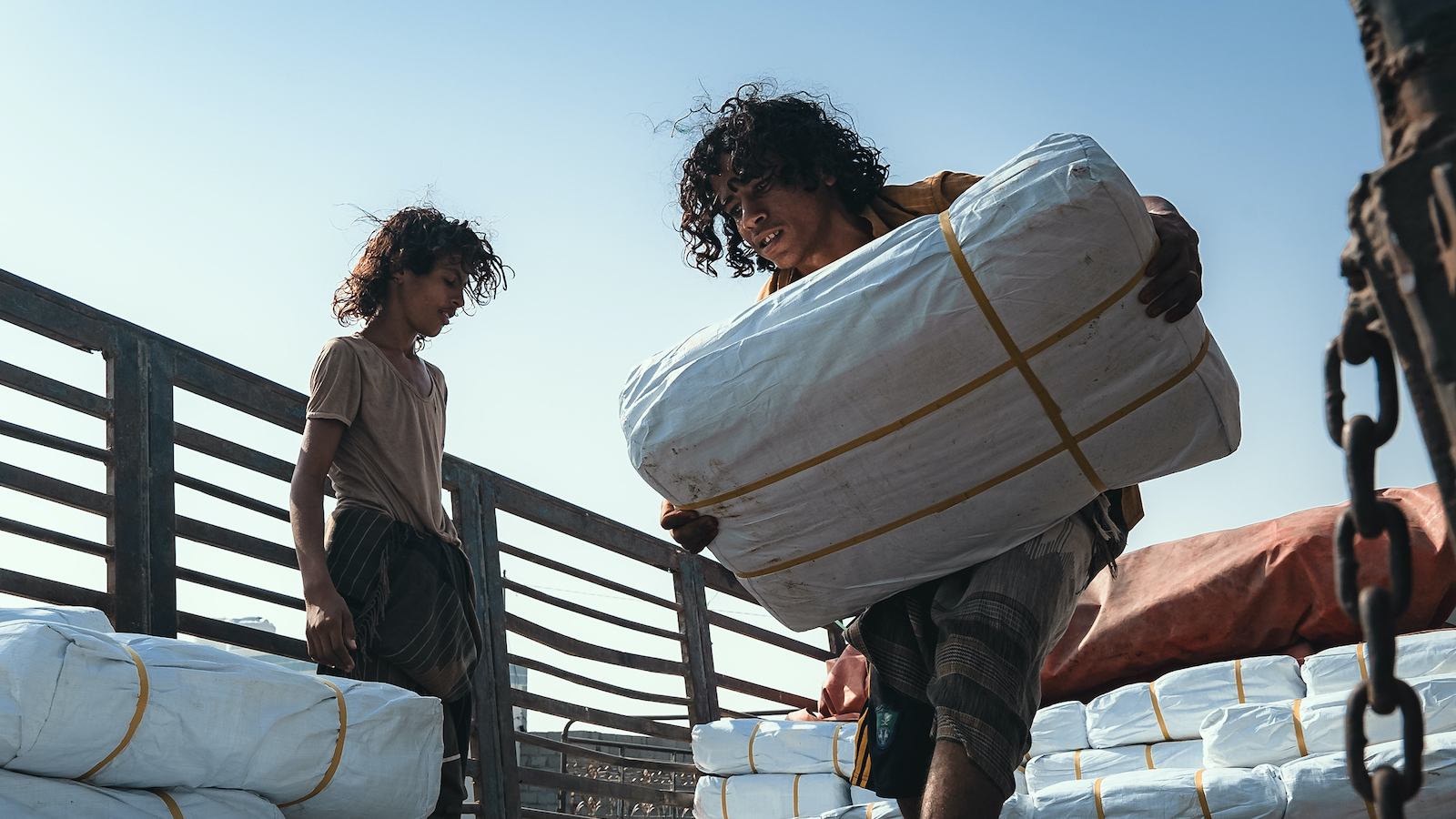 Concern team distribute shelter materials to people affected by the sandstorm that struck Al Anad IDP Camp, Tuban District. (Photo: Ammar Khalaf/Concern Worldwide)