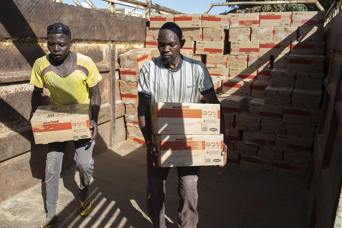 Workers in Adré, Chad load a consignment of 50 tons of Plumpy'Nut destined for West Darfur, Sudan. (Photo: Kieran McConville)
