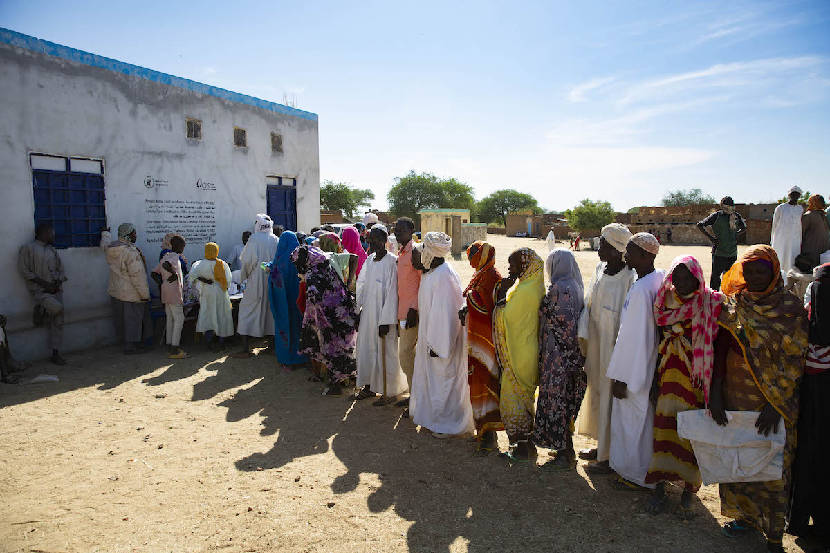 An emergency aid distribution in Sudan, where 33.7 million people will require assistance in 2026.