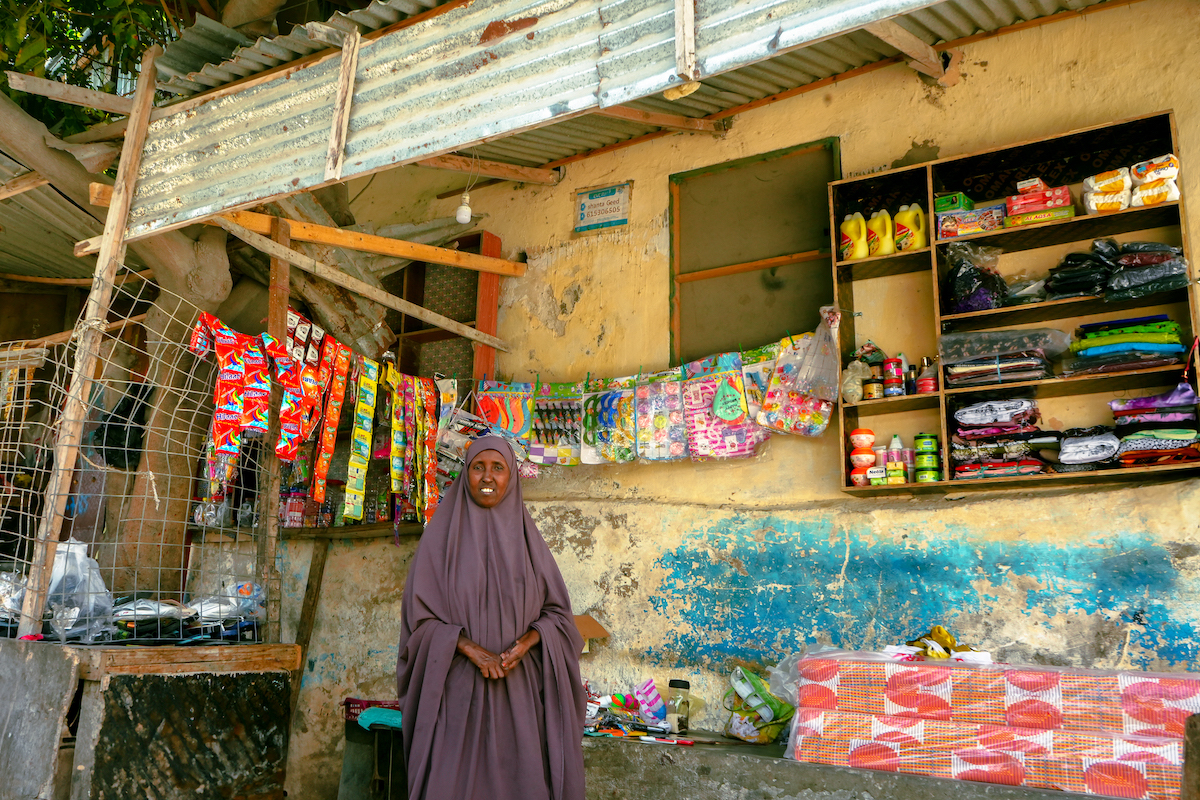 Mako Saney outside of her shop in Mogadishu. She was able to set up a thriving business after participating in a Concern-led Self-Help Group and livelihoods trainings. Photo: Adnan Mohamed/Concern Worldwide