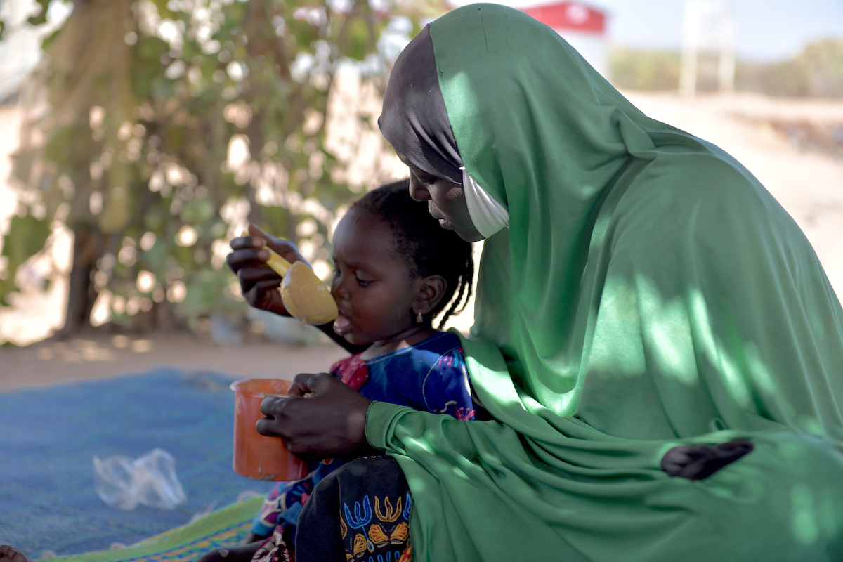 A child eats porridge made from fortified flour in Ouallam displacement site in Niger's Tillabéri region.