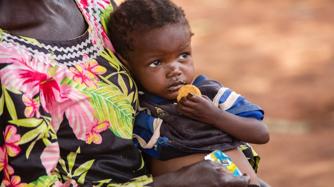 Dominique* holds her orphaned grandchild Sylvie* in Bossembele-Yaloke, Pama Village, Central African Republic. (Photo: Mussa Uwitonze/Arete/Concern Worldwide)