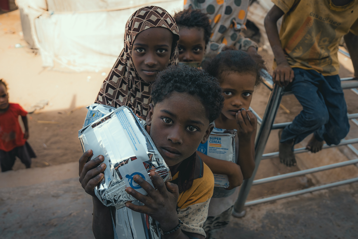 Local families receive nutritional supplementary food from the Concern supported health clinic in one of the displacement camps in Tuban district where Concern provides health and nutrition services. Photo: Concern Worldwide