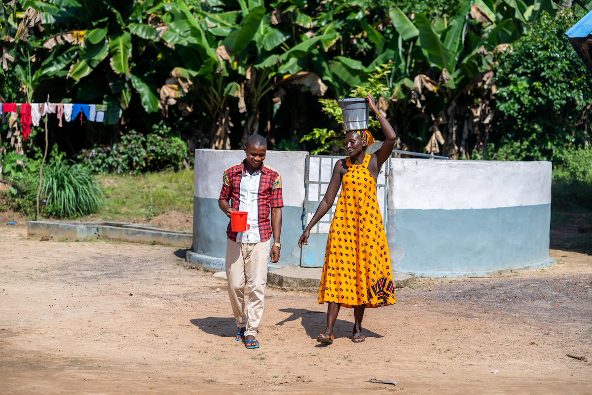 Conteh and Agnes G. Sesay at the community water pump in Mathoranka Community, Sierra Leone.