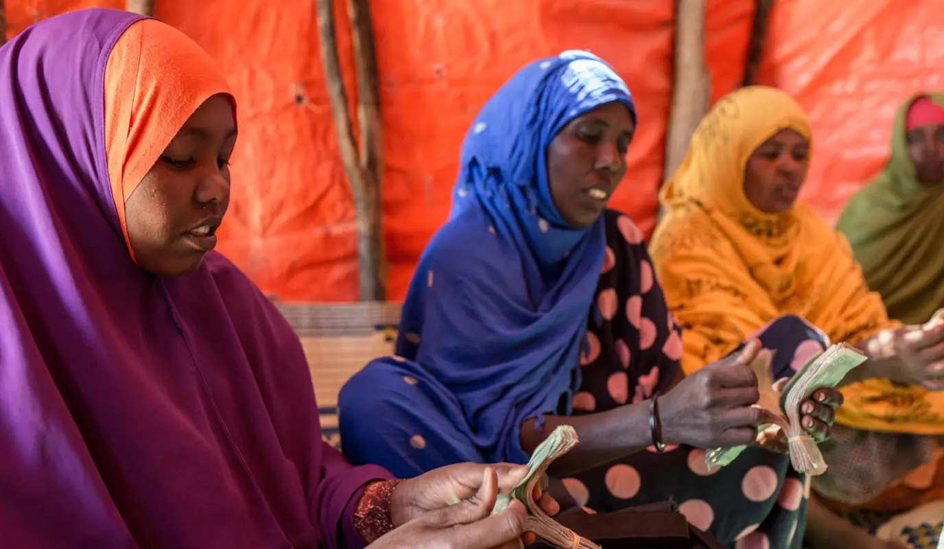 Fowzia Hassan (pictured on the left in purple) is part of a community organisation. Her and other women in the village joined this committee. It was established in 2018. The women learned how to survive hardships such as drought. They have weekly meetings to discuss issues raised by members and discuss how to work and develop these issues. (Photo: Mustafa Saeed/Concern Worldwide)