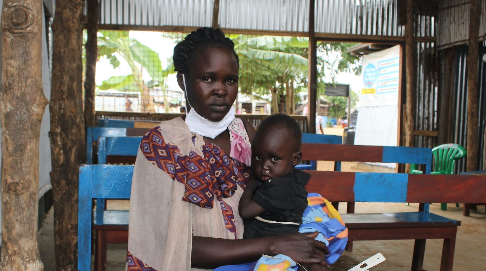 Nyaluit Khan and her 14 month old child Chudier at the Concern Nutrition Center to receive therapeutic food supplements. (Photo: Samir Bol / Concern Worldwide)