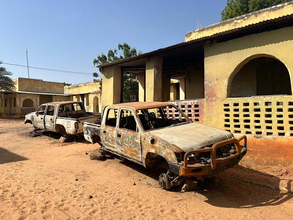 Burnt-out vehicles near a Concern-supported health facility in West Darfur