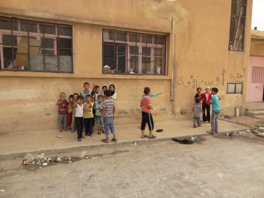 Children playing in their new home which is an abandoned school in Syria, September 2013. Photo: Arjan Ottens