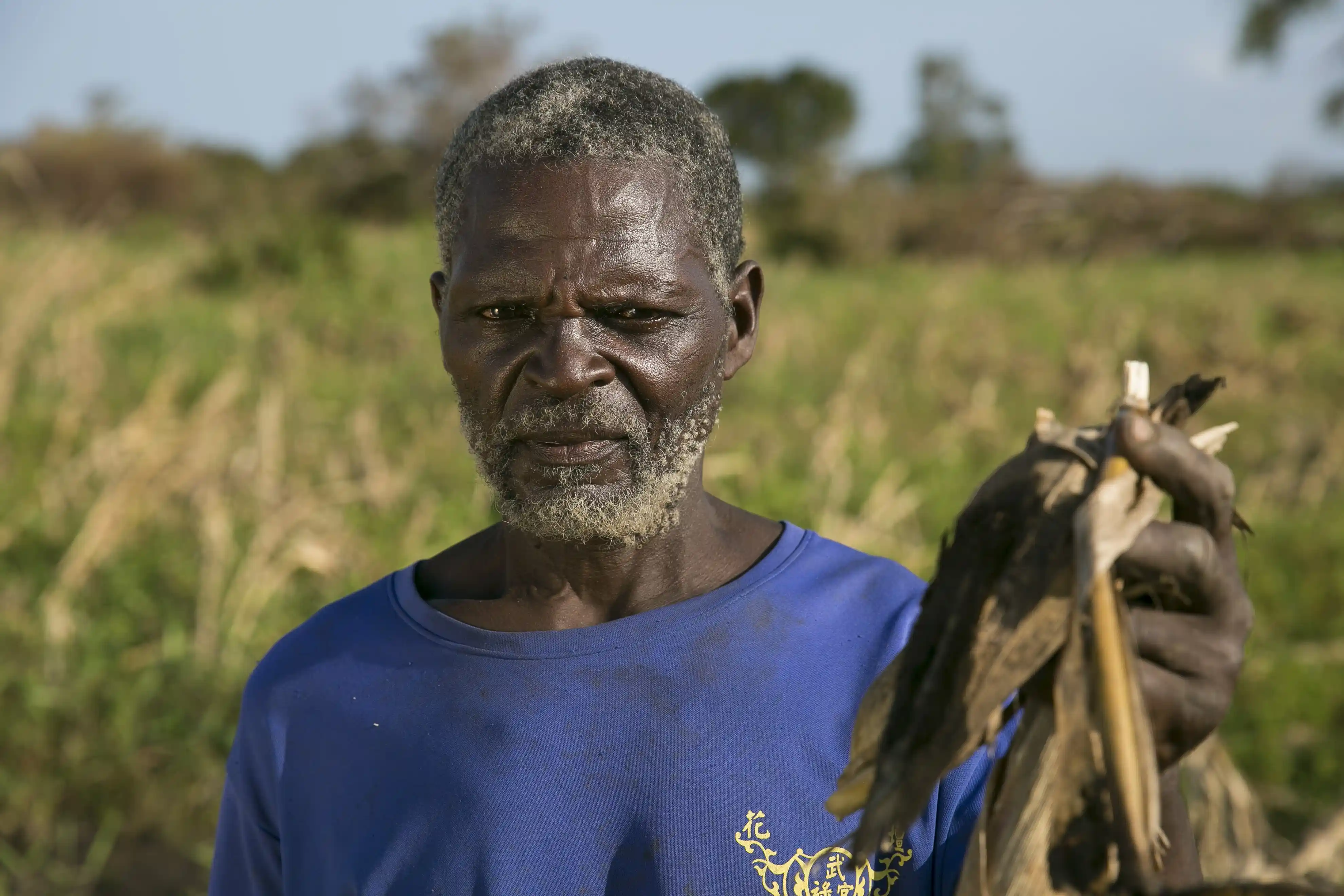 Ernesto Gambulene with the ruined maize crop from his field in Lamego