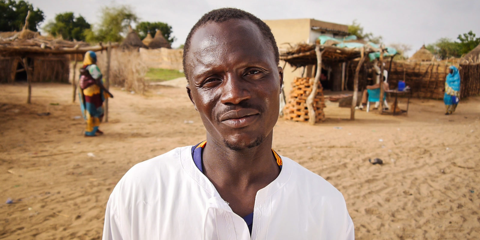 Man standing in street of town in rural Chad