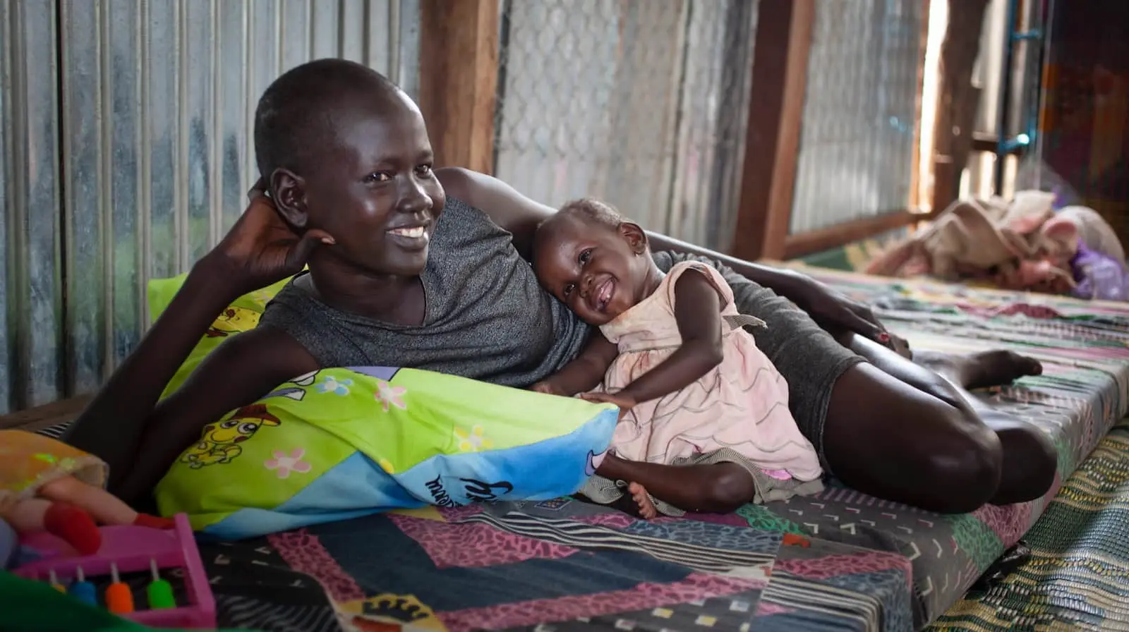 Mother and child in the mother and baby room at the Concern Worldwide Nutrition Clinic in a POC in Juba, South Sudan