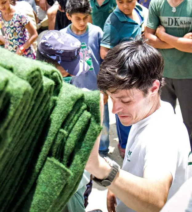 Concern's Kirk Prichard unloads carpets for a distribution in Talamarang, a village in Sindhupalchok district, one of the hardest hit areas by the 7.8-magnitude earthquake that struck Nepal on April 25, 2015.