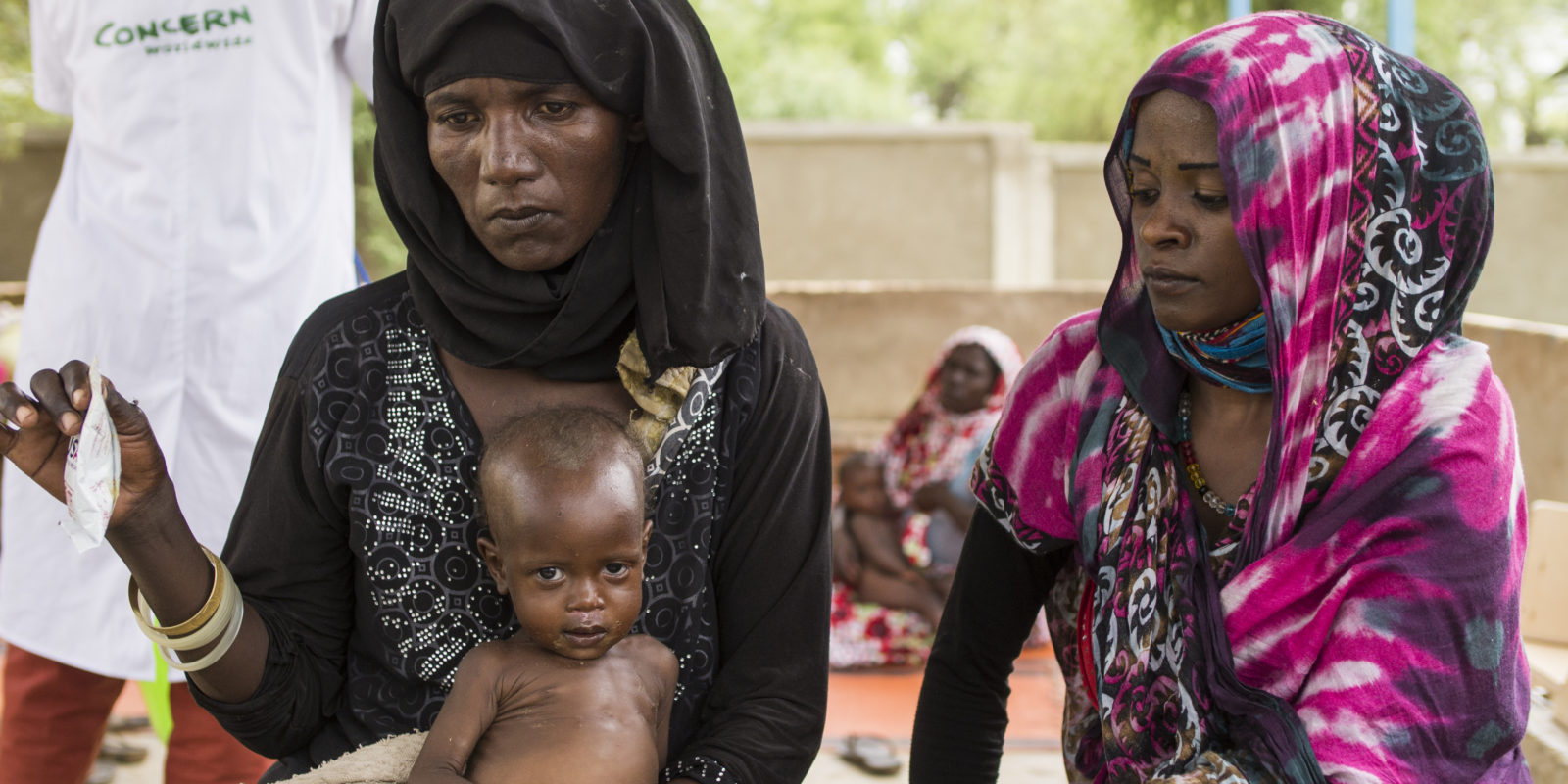 Two women and an infant at a health clinic in Chad