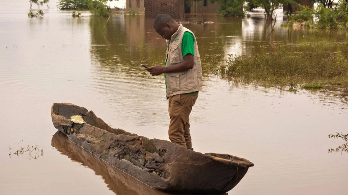 Tommy Chimpanzi, Concern District Program Manager in Nsanje, among the floods caused by Cyclone Freddy, 2023. (Photo: Concern Worldwide)