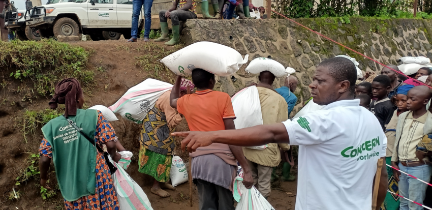 Humanitarian workers distributing aid and supplies to people