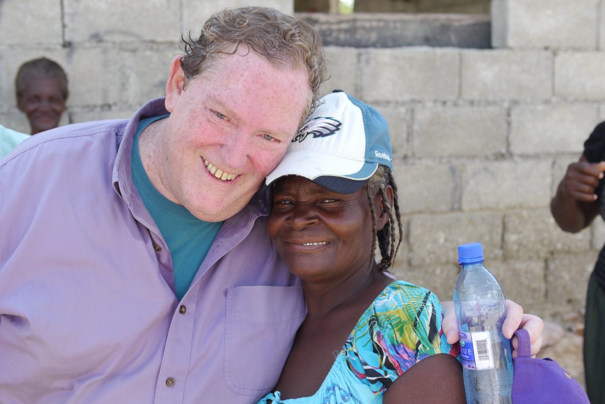 Tom Moran hugging a woman