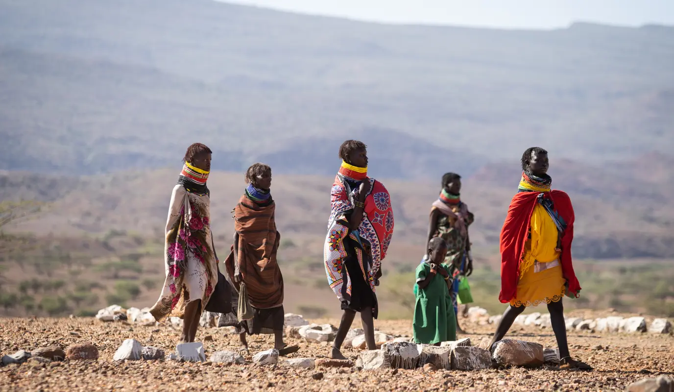 women and children in arid landscape women and children in arid landscape